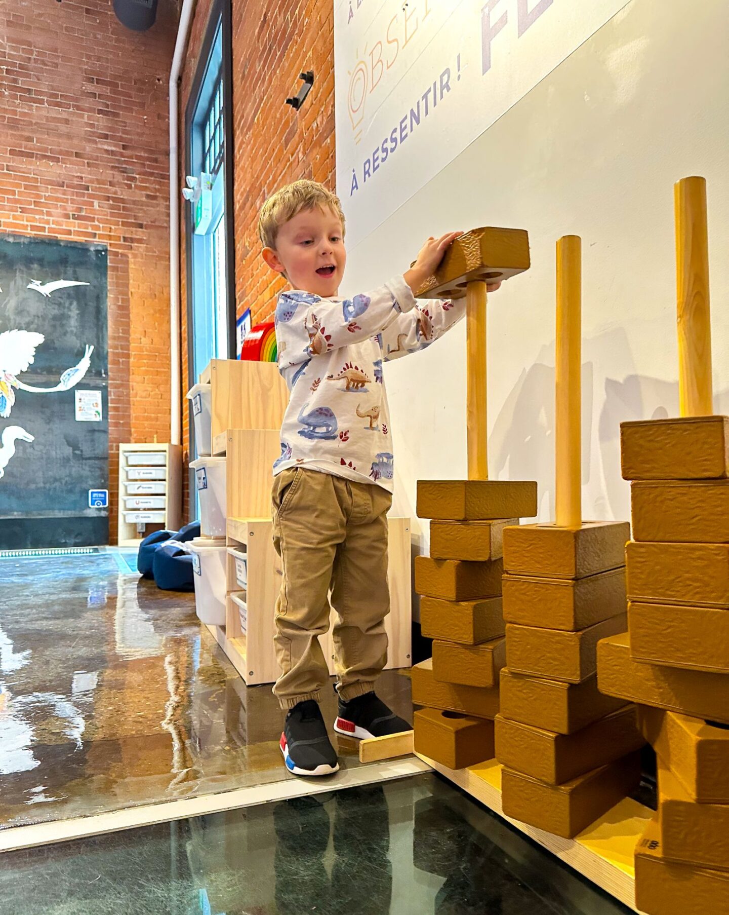 little boy playing with blocks at the discovery centre